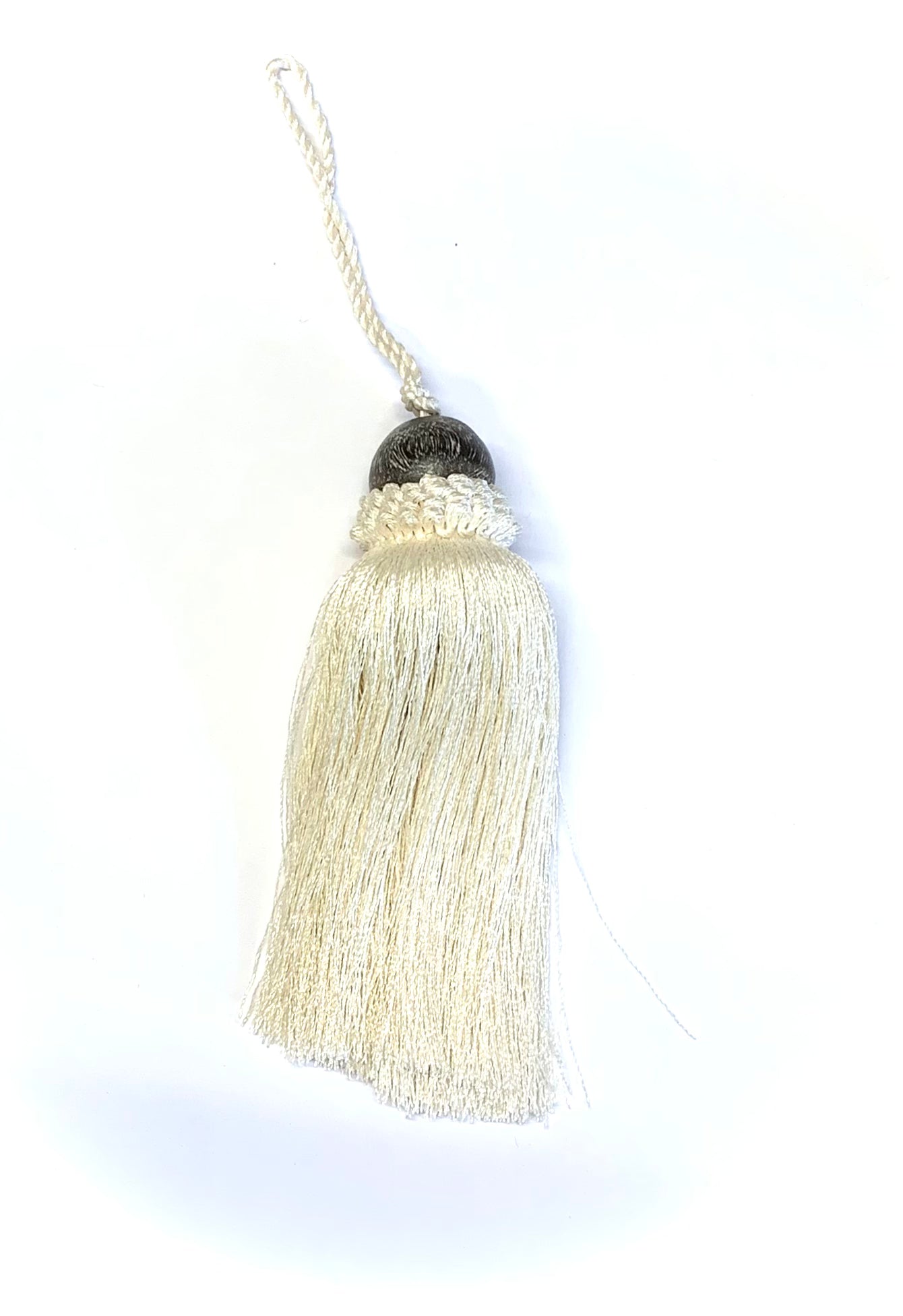 Luonnonvalkoinen tupsu